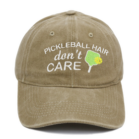 Khaki cap with 'Pickleball Hair don't Care' text and pickleball paddle graphic on a white background