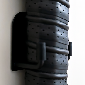 Gray leather belt with black buckle on a white background