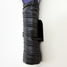 Black and purple garden tool handle on a white background