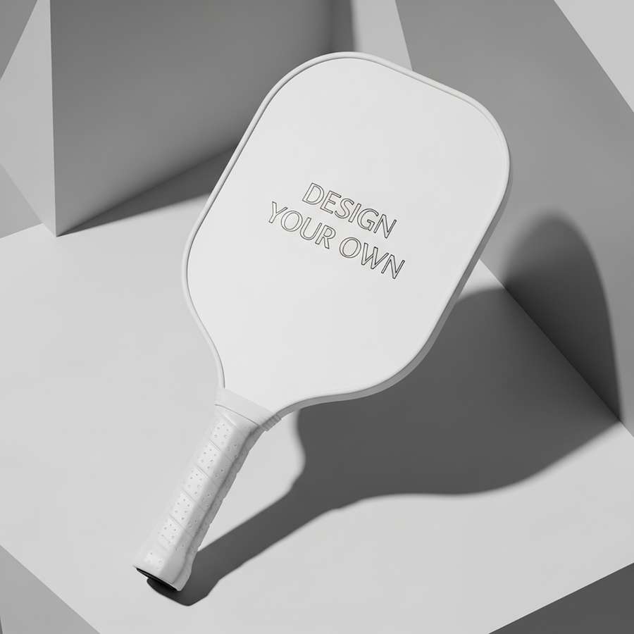 White custom pickleball paddle with Design Your Own text on a geometric gray background